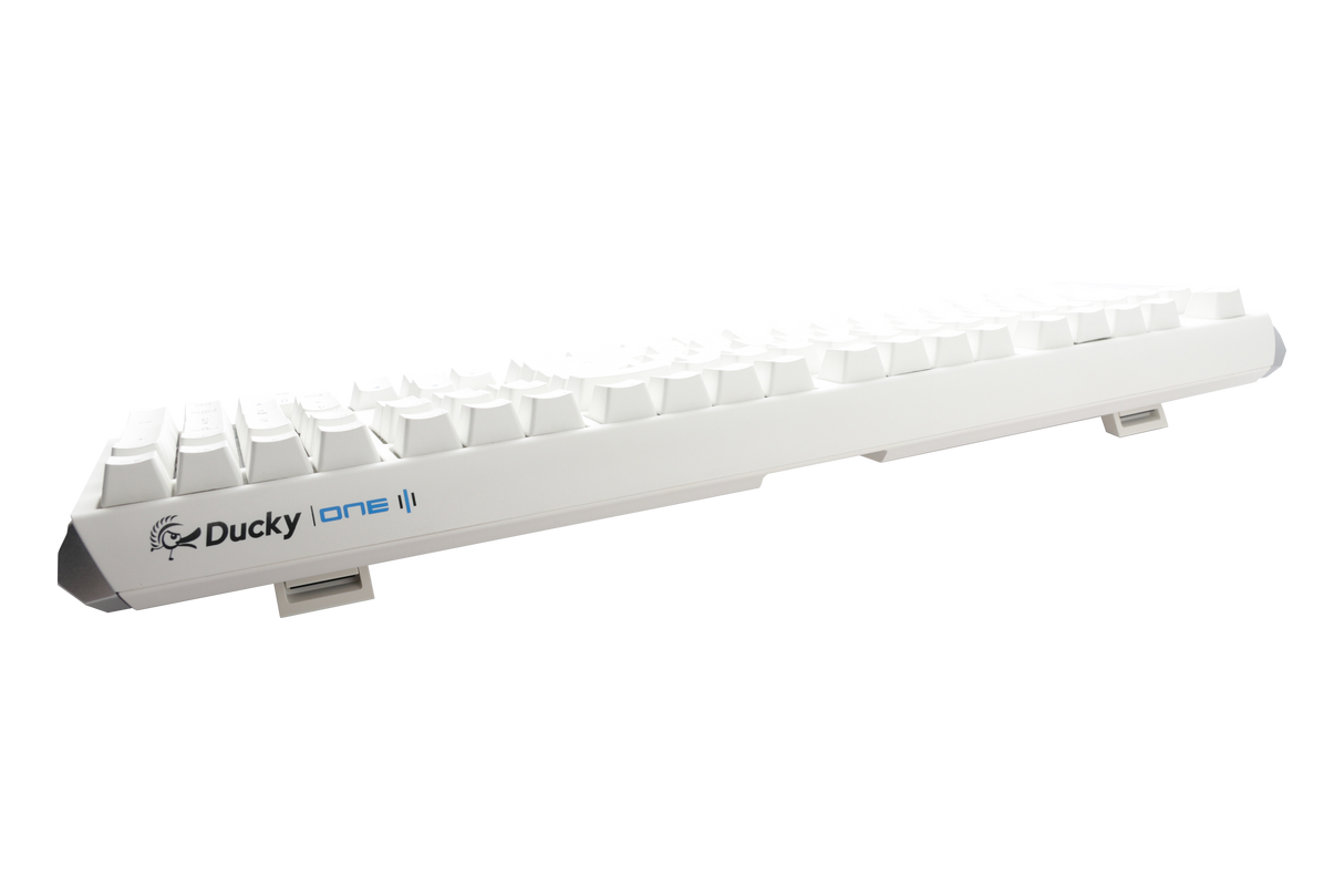 A Ducky One 3 - Classic Pure White Nordic - Fullsize - Cherry Silent Red mechanical keyboard with white PBT keycaps on a white background, viewed from a side angle, highlighting the elevated keys and brand logo.