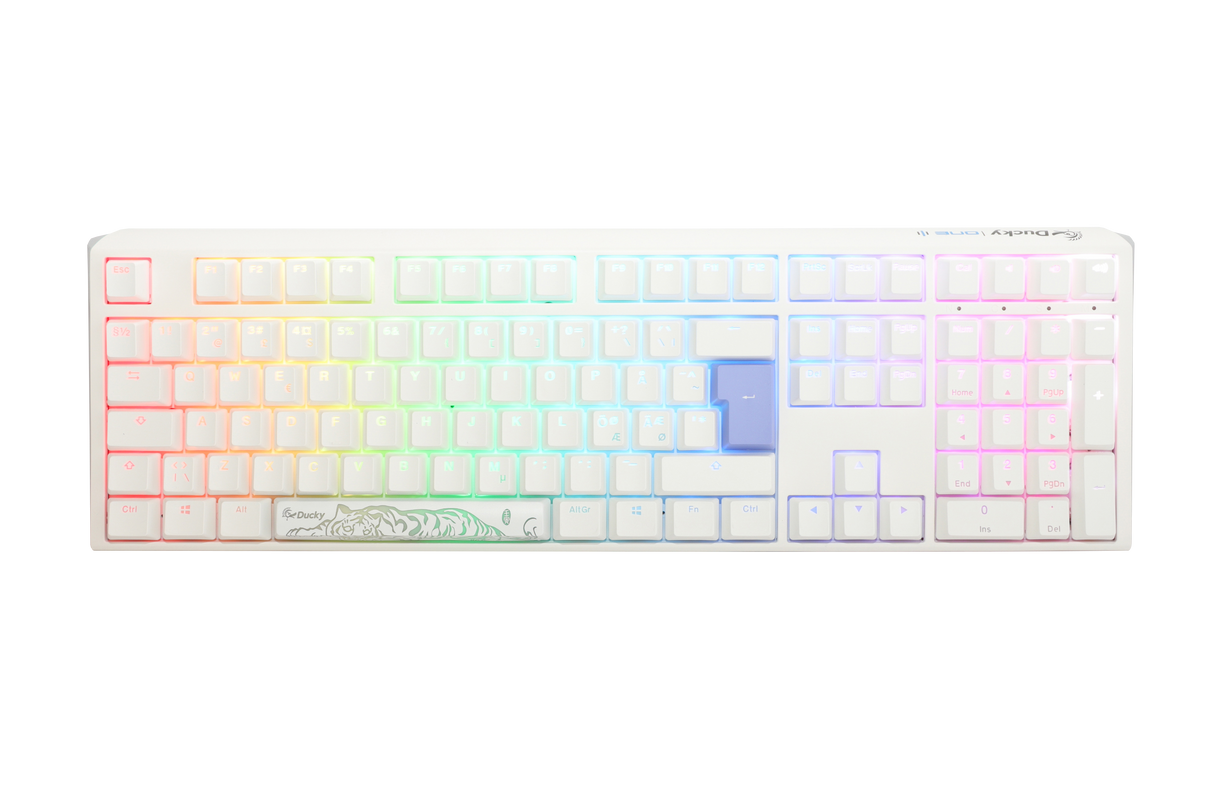 A Ducky mechanical keyboard with multicolored backlit keys, ranging from red through the spectrum to purple, featuring double-shot PBT keycaps and a custom white casing with a floral design on the bottom right.