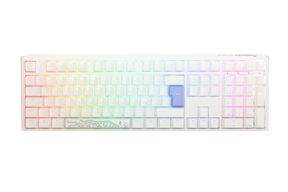 A Ducky mechanical keyboard with multicolored backlit keys, ranging from red through the spectrum to purple, featuring double-shot PBT keycaps and a custom white casing with a floral design on the bottom right.