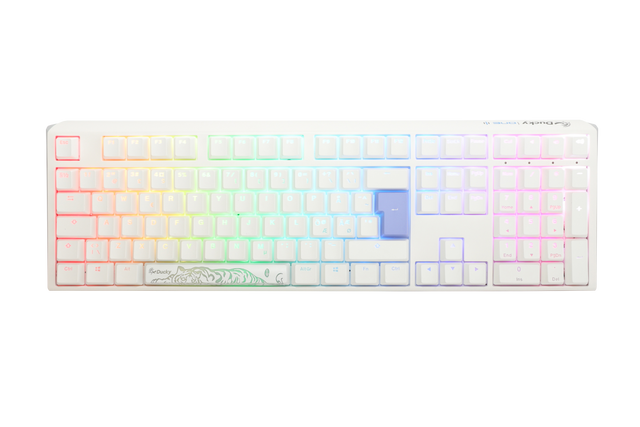 A Ducky mechanical keyboard with multicolored backlit keys, ranging from red through the spectrum to purple, featuring double-shot PBT keycaps and a custom white casing with a floral design on the bottom right.