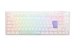 A Ducky white mechanical keyboard with PBT keycaps and pastel-colored, backlit keys featuring RGB lighting. The space bar has an artistic, teal wave design.