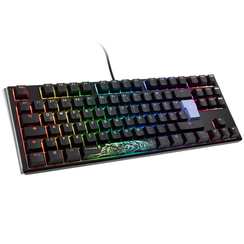 Ducky Mechanical gaming keyboard with multicolored rgb backlighting, visible key layout from esc to right ctrl, and a usb cable on a white background featuring Cherry MX Blue switches.