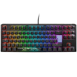 A colorful backlit mechanical gaming keyboard with vivid rainbow lighting across keys, featuring a distinct green tiger decal on the spacebar and equipped with Ducky One 3 - Classic Black / White Nordic - TKL - Cherry Blue switches.